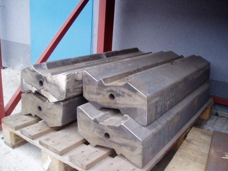 Close-up of impact crusher blow bar castings